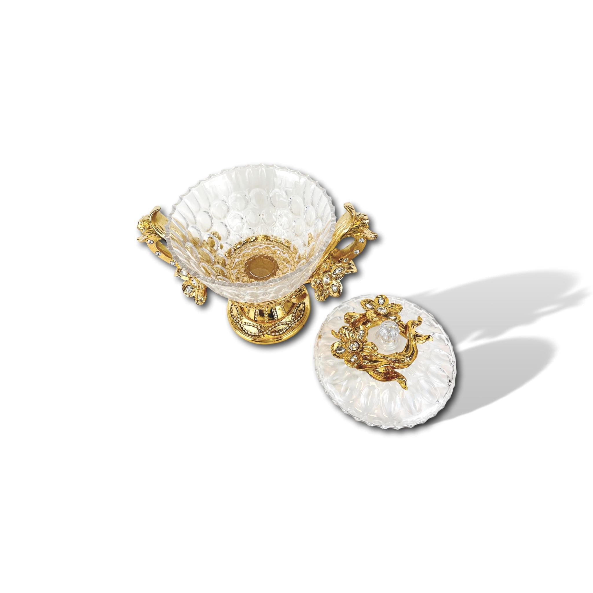 Decorative bowl made of glass with lid and gold-plated decorations made of synthetic resin
